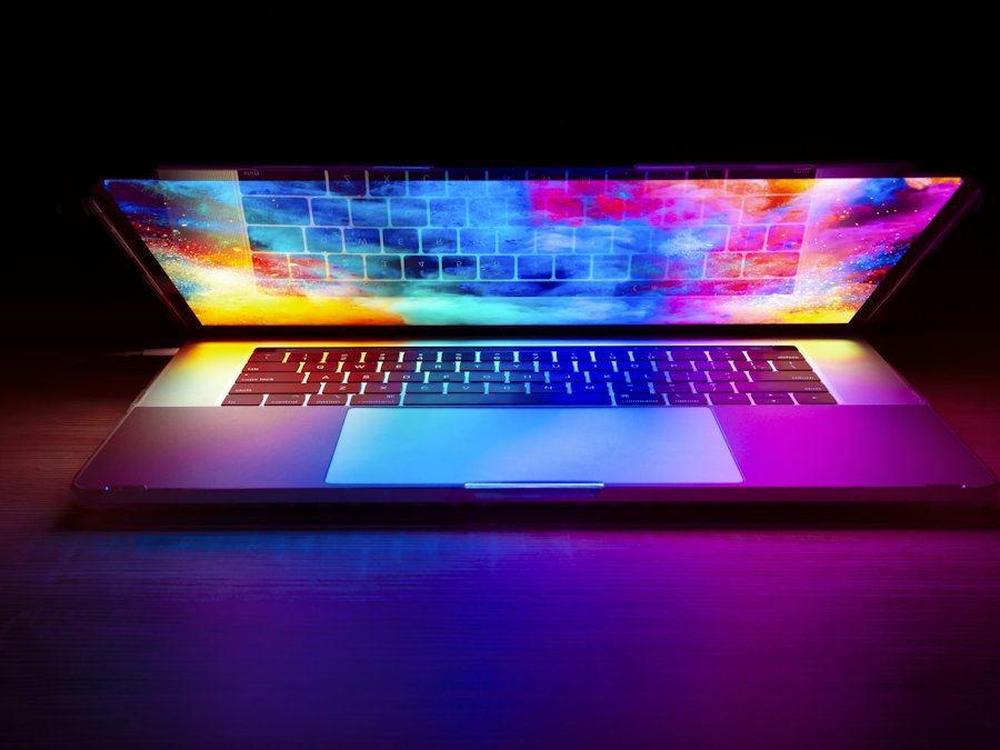 Open laptop with a glowing colorful screen