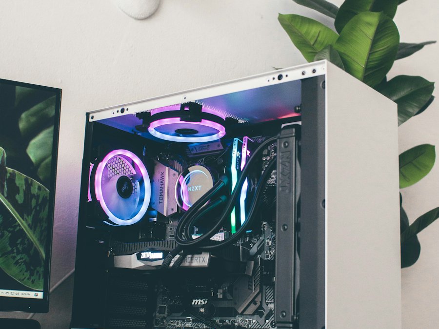 Custom PC build with lit fans in a white case